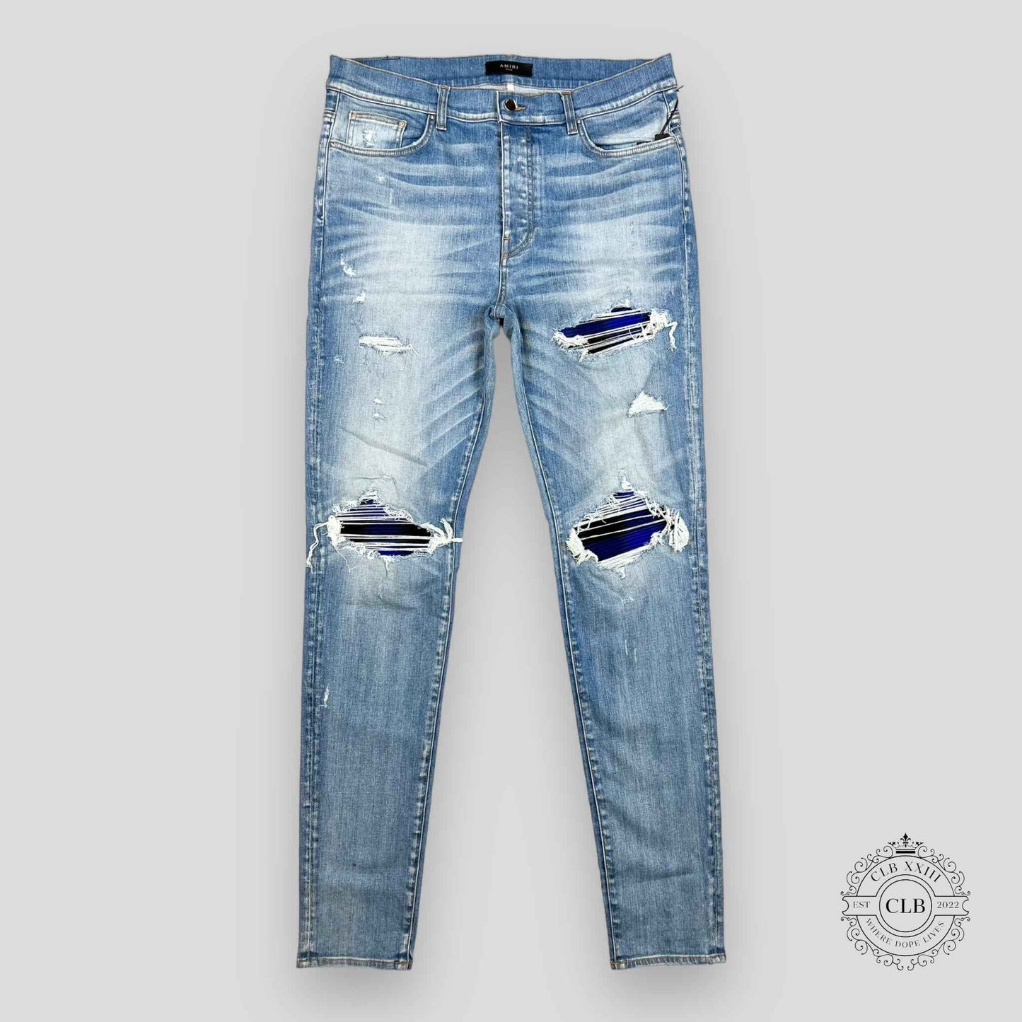 AMIRI PLAID THRASHER JEANS - LIGHT INDIGO