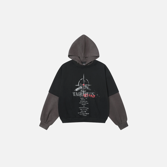 Front view of model wearing black fake two-piece hoodie with white letter print and grey layered sleeves