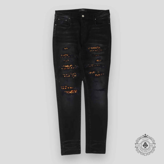 Amiri Leopard Patch Thrasher Jeans in Black