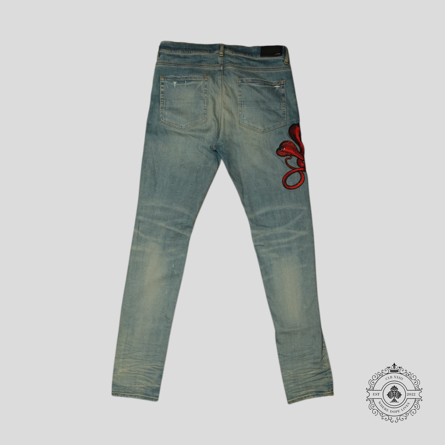 Amiri Red Poison Archival Jeans in Medium Wash