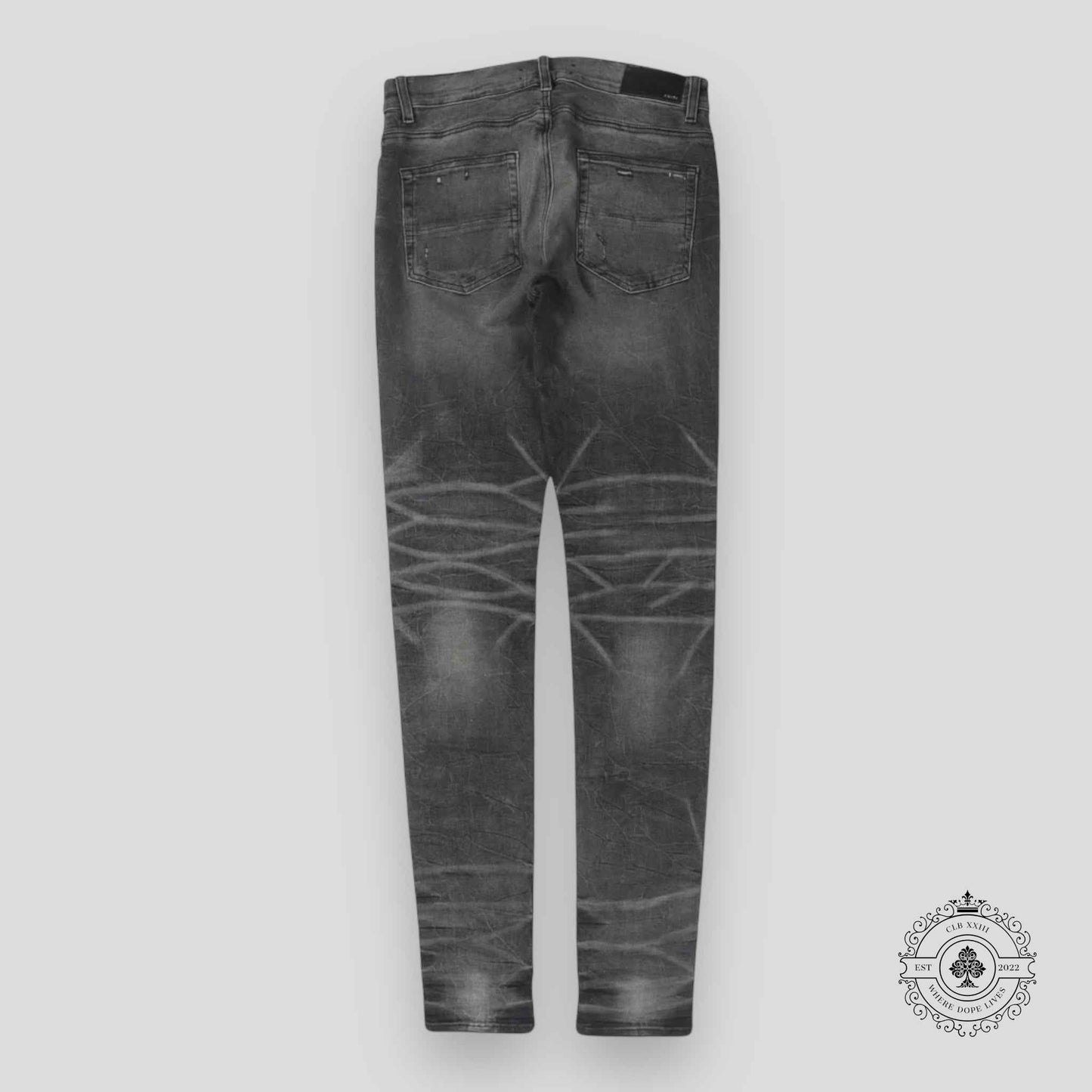 Amiri Faded Denim Jeans in Grey