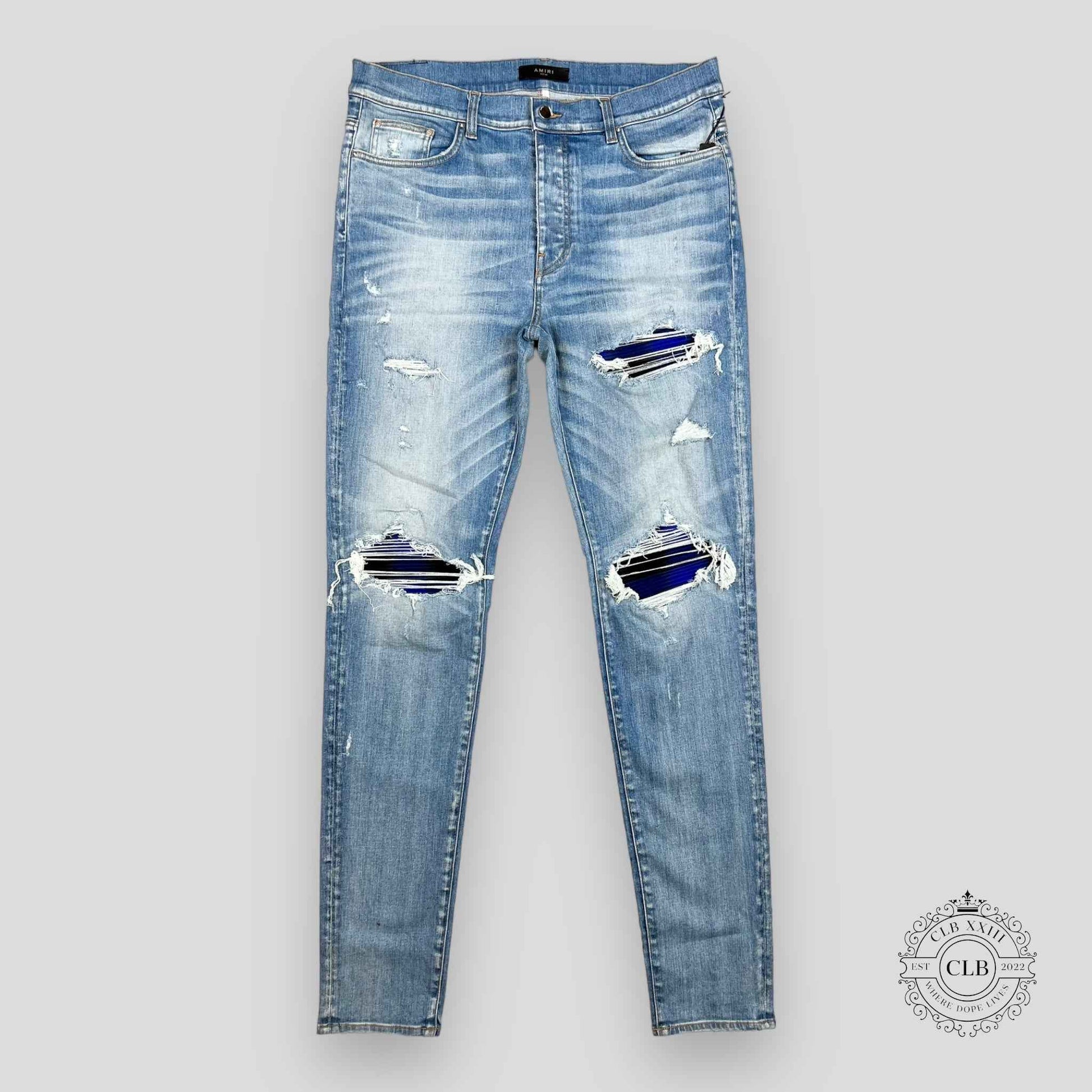AMIRI PLAID THRASHER JEANS - LIGHT INDIGO
