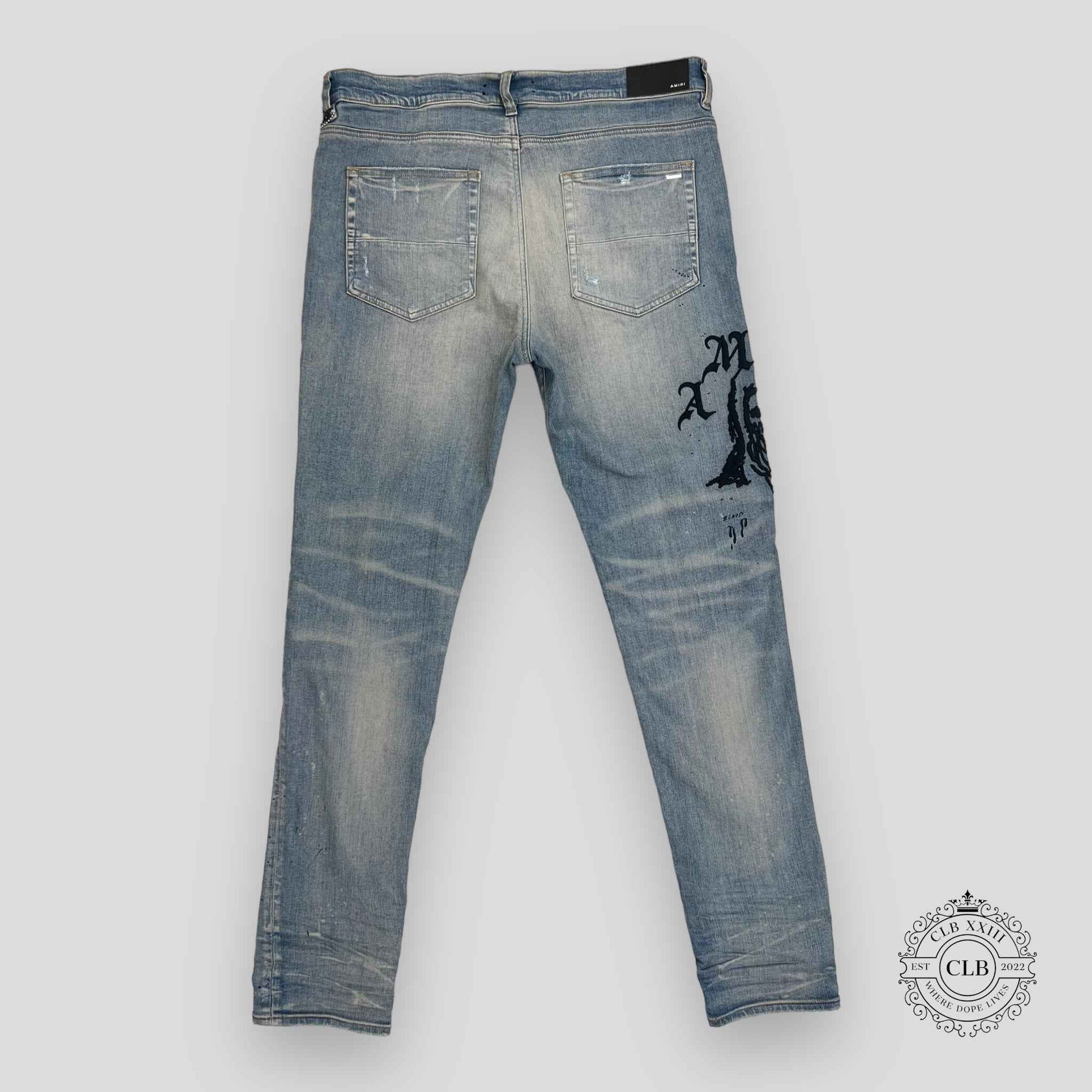 AMIRI X WES LANG REAPER LOGO JEANS - CLAY INDIGO