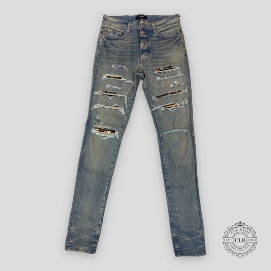 Amiri Lunar New Year Thrasher Jeans in Clay Indigo